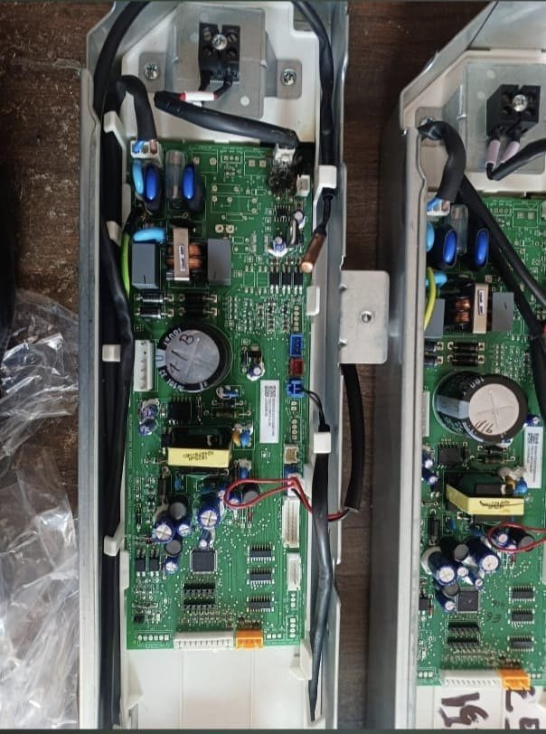 Two main boards side by side on the bench during a board swap.
